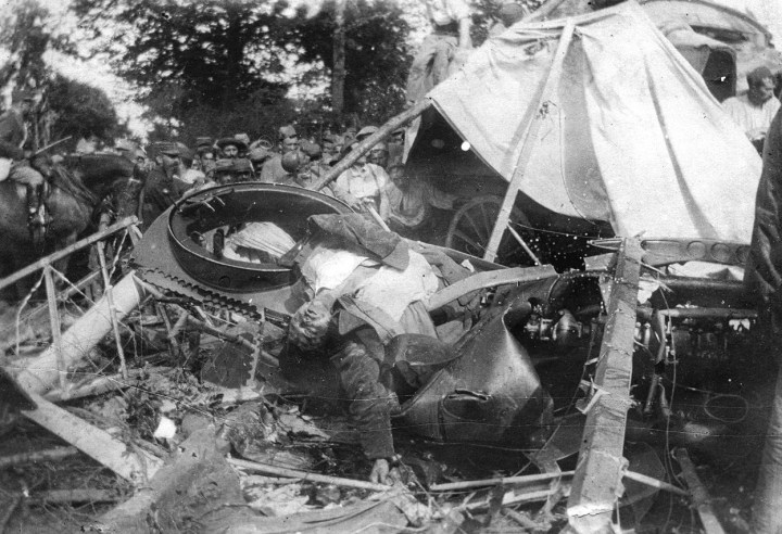 A German pilot lies dead in his crashed airplane in France, in 1918. Ironically, the Germans were issuing parachutes by War's end. (National World War I Museum, Kansas City, Missouri, USA) 