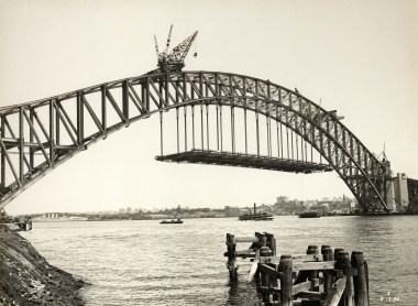 Sydney Harbour Bridge under construction on December 2nd, 1930, with the road decking being hung from the famed steel arches.  (State Records NSW, 12685 a00704 8731000013r) 
