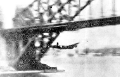 Queen's passage. A blurred but incomparable snap of Lancaster Mk I Q for 'Queenie VI' passing under Sydney Harbour Bridge, October 22nd, 1943.