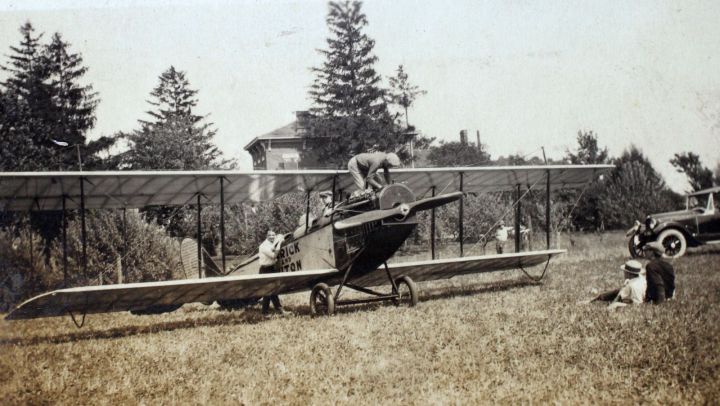 Check the engine oil... A barnstormer gives his JN4-D the recommended once-over before a flight. (From an album formerly belonging to barnstormer and daredevil Carter Buton.) SDASM Carter Buton Album Loan_00063