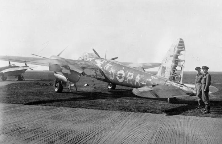 Flight Lieutenant M A Cybulski RCAF and Flying Officer H H Ladbrook RAFVR show off their scorched Mosquito NF Mk.II at Coleby Grange, on September 27th, 1943. Anyone worried about flying a wooden plane into combat should consider how many others also flew with fabric covered control surfaces. (IWM CE 107)