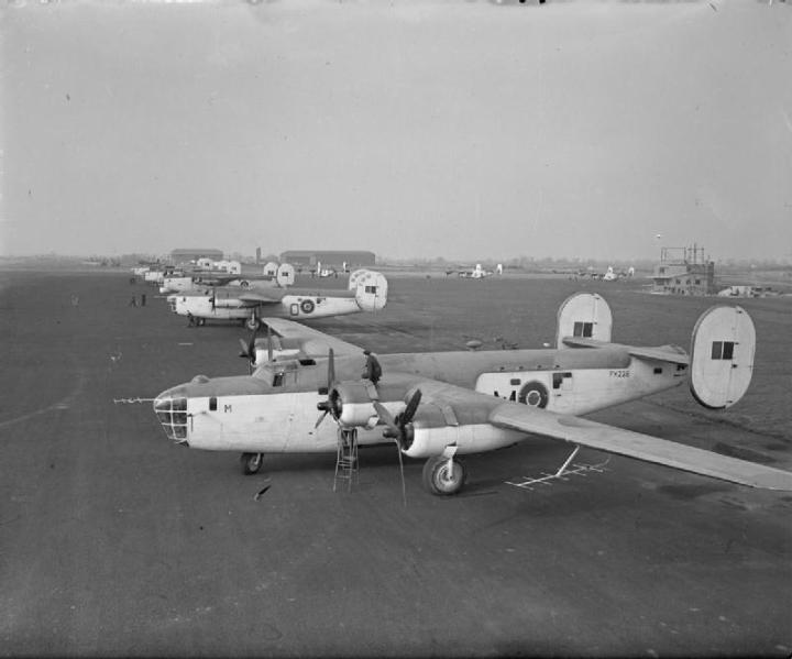 Liberator GR Mark IIIs, FK228 M and FL933 O, of No. 120 Squadron RAF, lined up with other aircraft at Aldergrove, County Antrim, N.Ireland. The third aircraft in line is a GR Mark V, FL952, of No. 86 Squadron RAF. (IWM CH 18035)