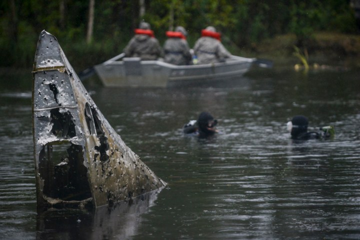 Divers from a joint Eielson AFB and Fort Wainwright team work back toward the tail fin of #214 on August 1st, 2014. Note the summer weather! (USAF photo, Snr Airman Peter Reft)