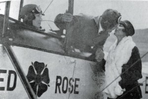 Triangulation... Lancaster kisses his wife Kiki farewell before the England-Australia flight, as Chubbie Miller looks on from the Avian's front cockpit. (© Lancaster family)