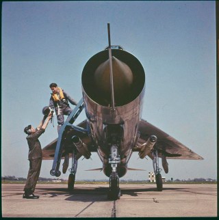 All shock cone and tailpipes... an RAF pilot boards his 'Frightning' in the mid-60s. © Crown copyright. IWM (RAF-T 5759)