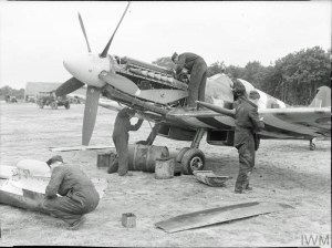 RAF No.91 Squadron ground crew attend to one of their Spitfire XIVs and its mighty Griffon at West Malling, Kent, in 1944. © IWM (CH 18183)