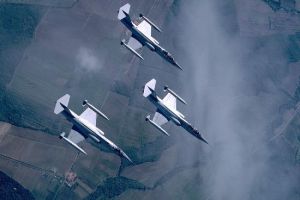 Three Italian F-104S Starfighters, stooging along high over their native countryside. (SDASM #00045358)