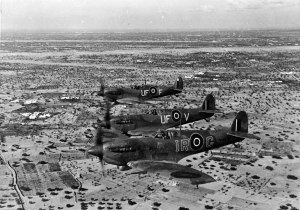 Three Spitfire LF Mk.Vb Trop over North Africa. The lead aircraft IR-G is piloted by Wing Commander Ian Richard "Widge" Gleed, 244 Wing. He was shot down and killed in the Cap Bon area of Tunisia on April 16th, 1943. (LoC P&P fsa.8e00953)