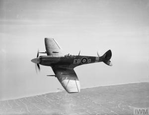 Showing the clipped wings of a low-level fighter, Spitfire Mk.XII 'EB-B' of 41 Squadron RAF performs for the camera in April 1944. (©IWM CH 12752)